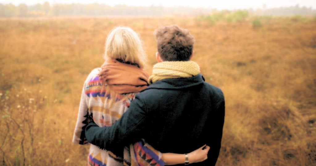 woman and man looking away from the camera